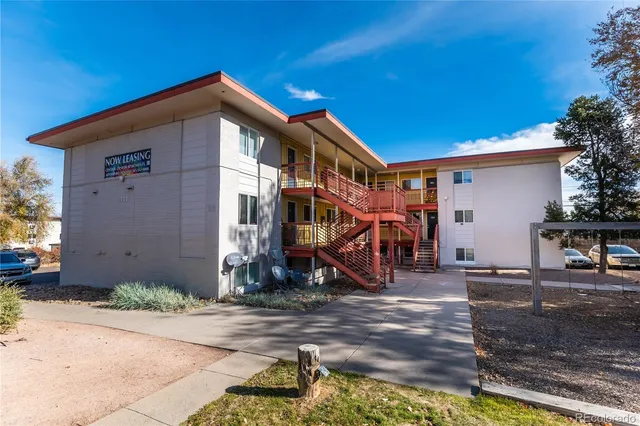 a view of a wooden house with a park