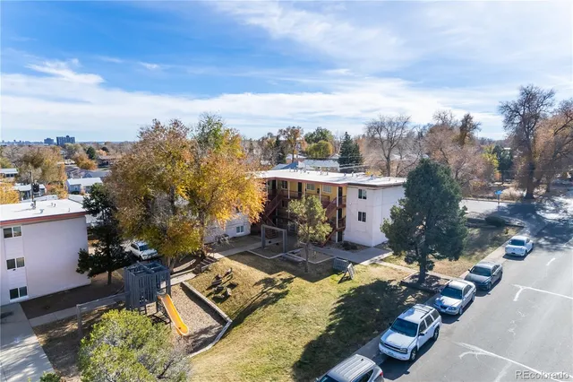 a view of a city street with a building