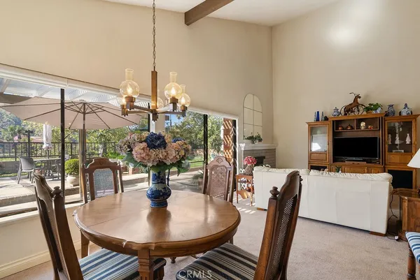 a dining room with furniture and chandelier