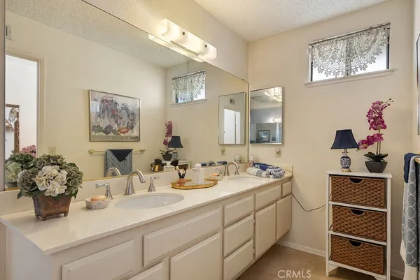 a bathroom with a sink mirror and vanity