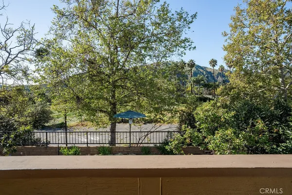 a view of balcony with a small yard