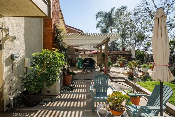 a view of a chairs and table in patio