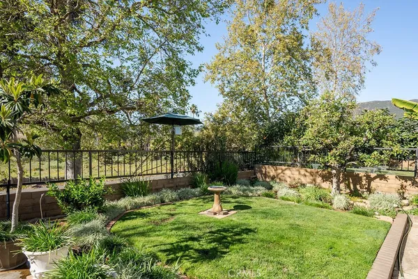 a backyard of a house with lots of green space