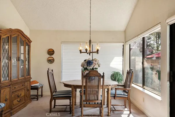 a dining room with furniture and window