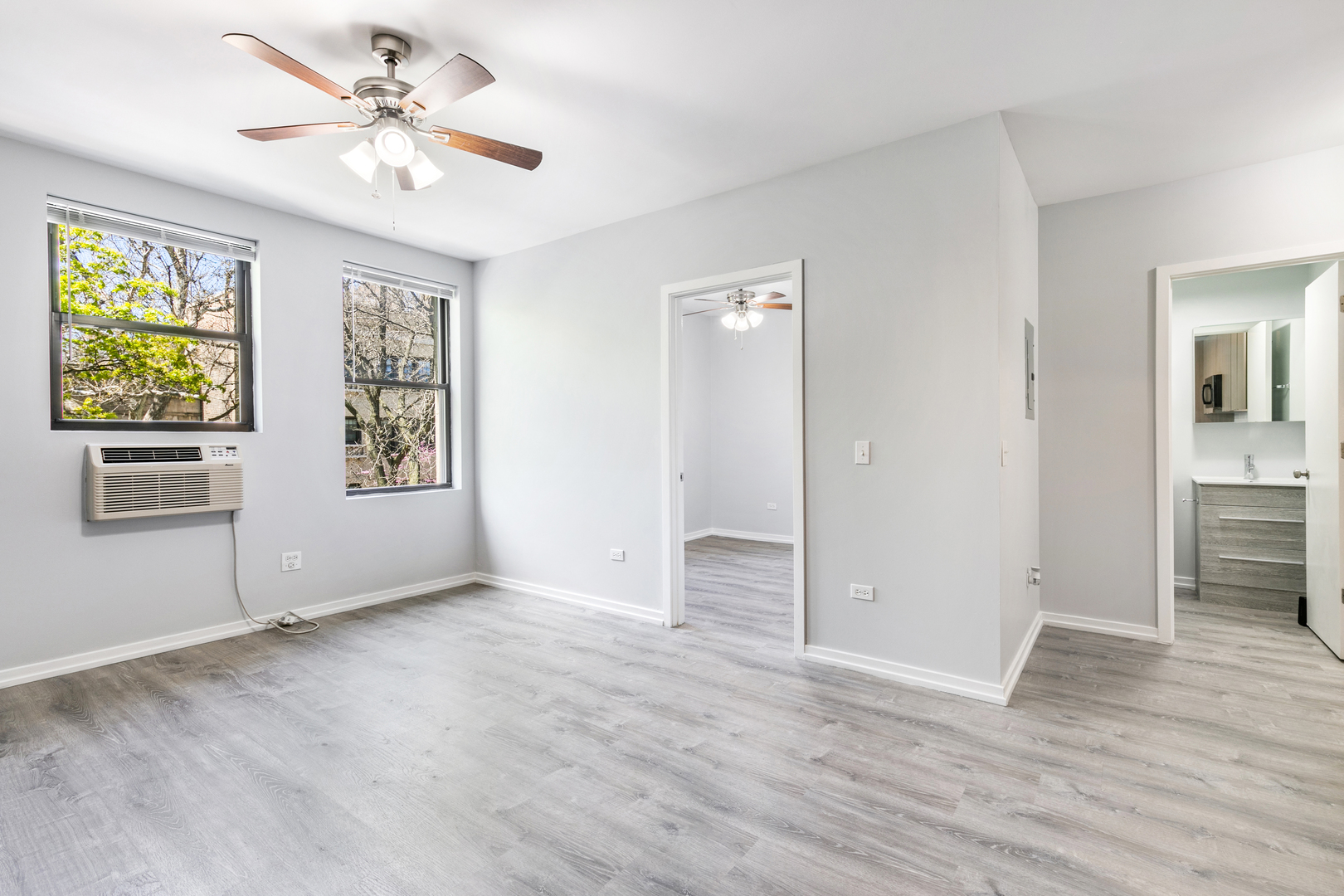 4875 North Magnolia Avenue, Unit 201 Chicago, IL 60640 - Photo 4 of 12 wooden floor in an empty room with a window