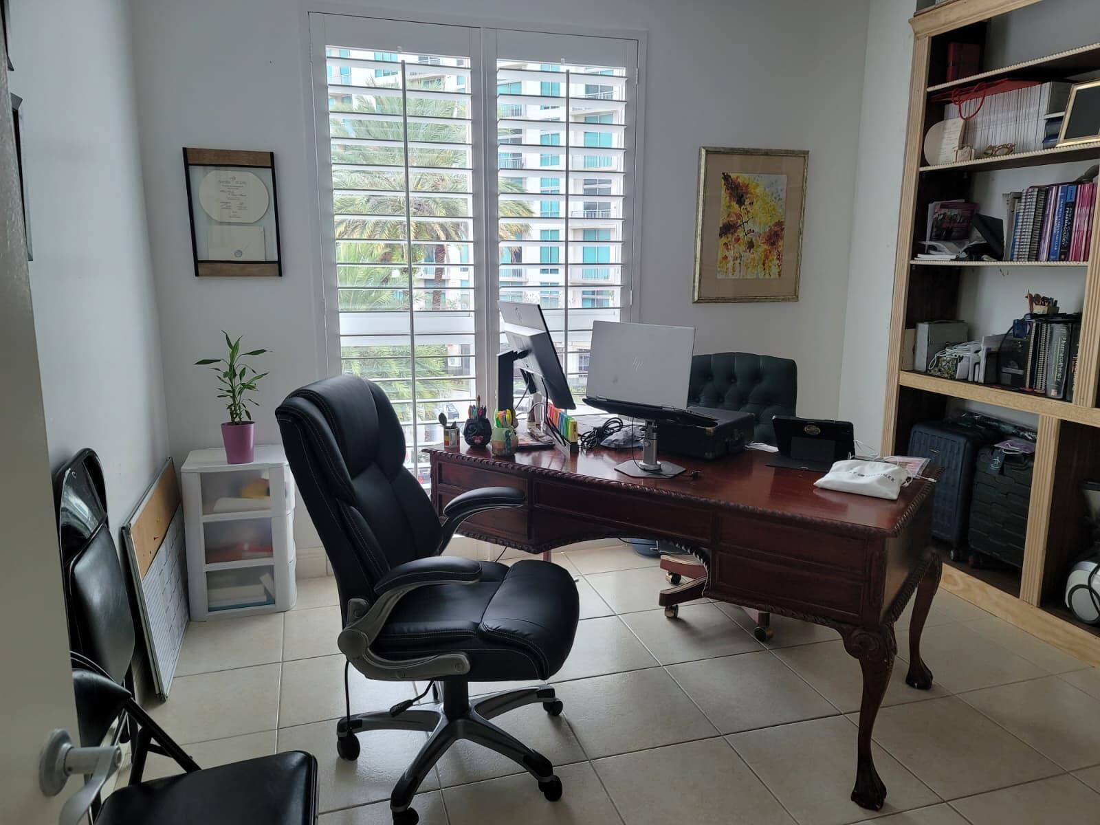 7275 Southwest 90th Way, Unit 311 Miami, FL 33156 - Photo 16 of 17 a view of a workspace with a window and lounge chair