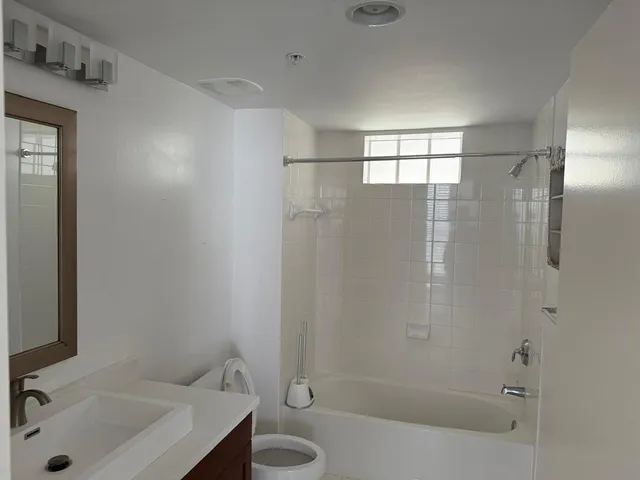 a bathroom with a sink and a shower