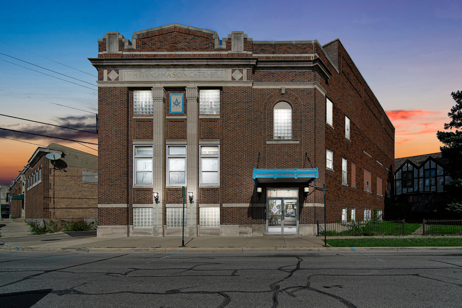 512 Temple Street Whiting, IN 46394 - Photo 2 of 22 a front view of a residential apartment building with a yard