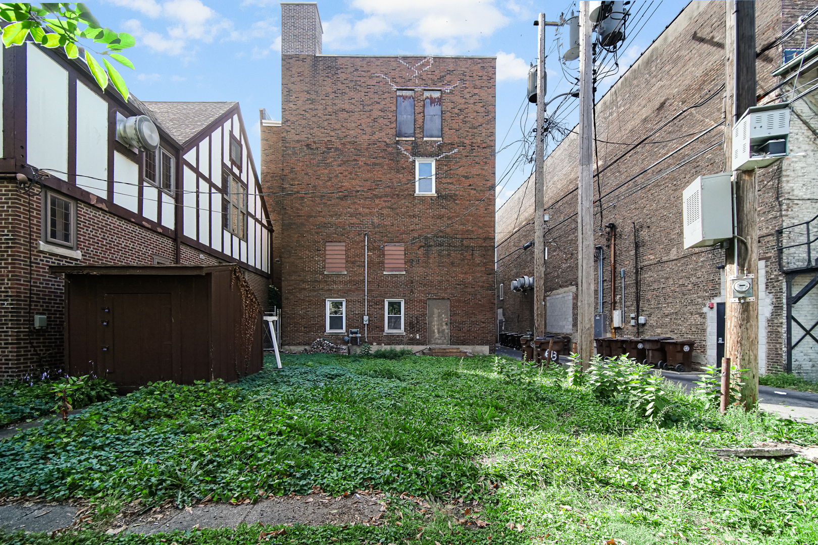 512 Temple Street Whiting, IN 46394 - Photo 4 of 22 a brick building with a yard in front of it