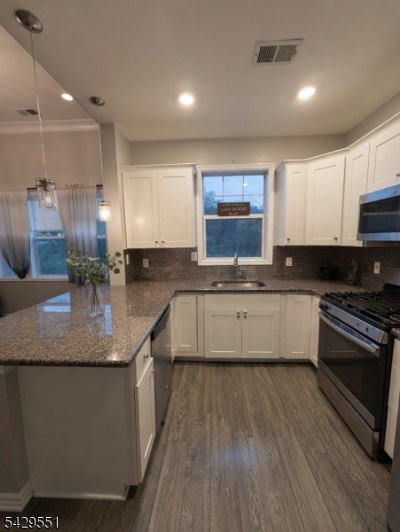 5 West River Styx Road, Unit 301 Hopatcong, NJ 07843 - Photo 2 of 8 a large kitchen with granite countertop a sink a counter space appliances and cabinets