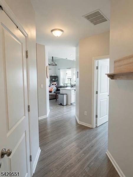 5 West River Styx Road, Unit 301 Hopatcong, NJ 07843 - Photo 7 of 8 a view of kitchen view refrigerator and wooden floor