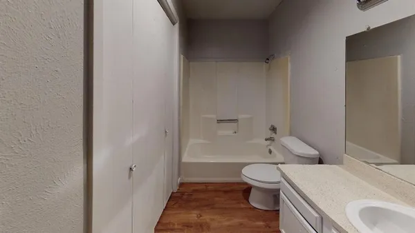 a bathroom with a sink a toilet and a bathtub