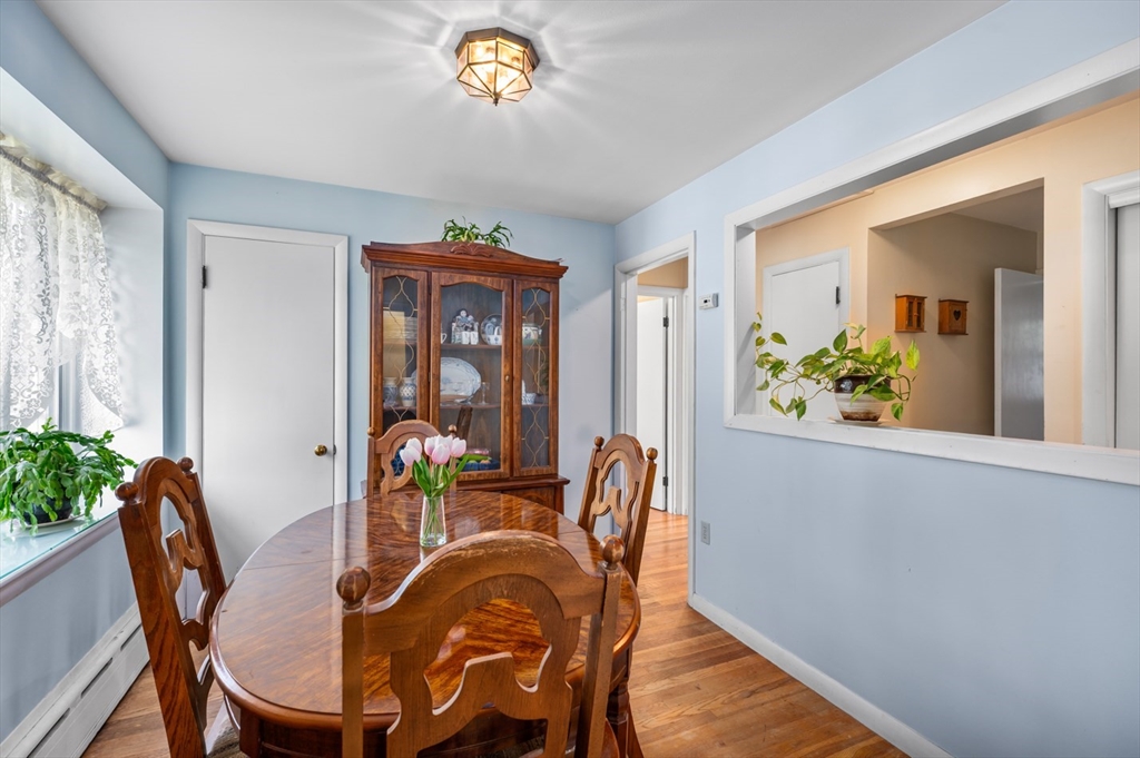 12 Kimball Road Amesbury, MA 01913 - Photo 13 of 36 a view of a dining room with furniture window and wooden floor