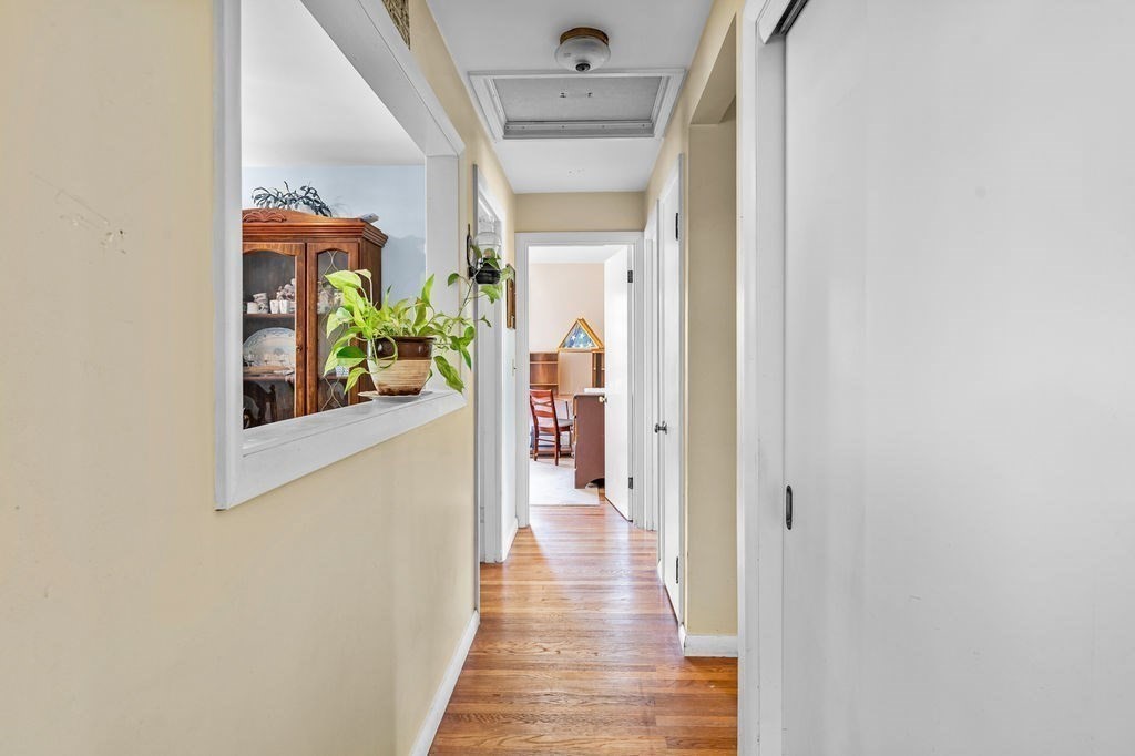 12 Kimball Road Amesbury, MA 01913 - Photo 15 of 36 a view of a hallway view with wooden floor and staircase