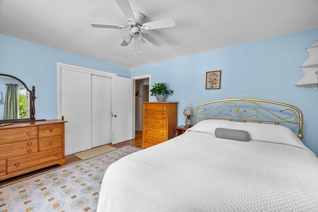 12 Kimball Road Amesbury, MA 01913 - Photo 19 of 36 a bedroom with a bed and a dresser