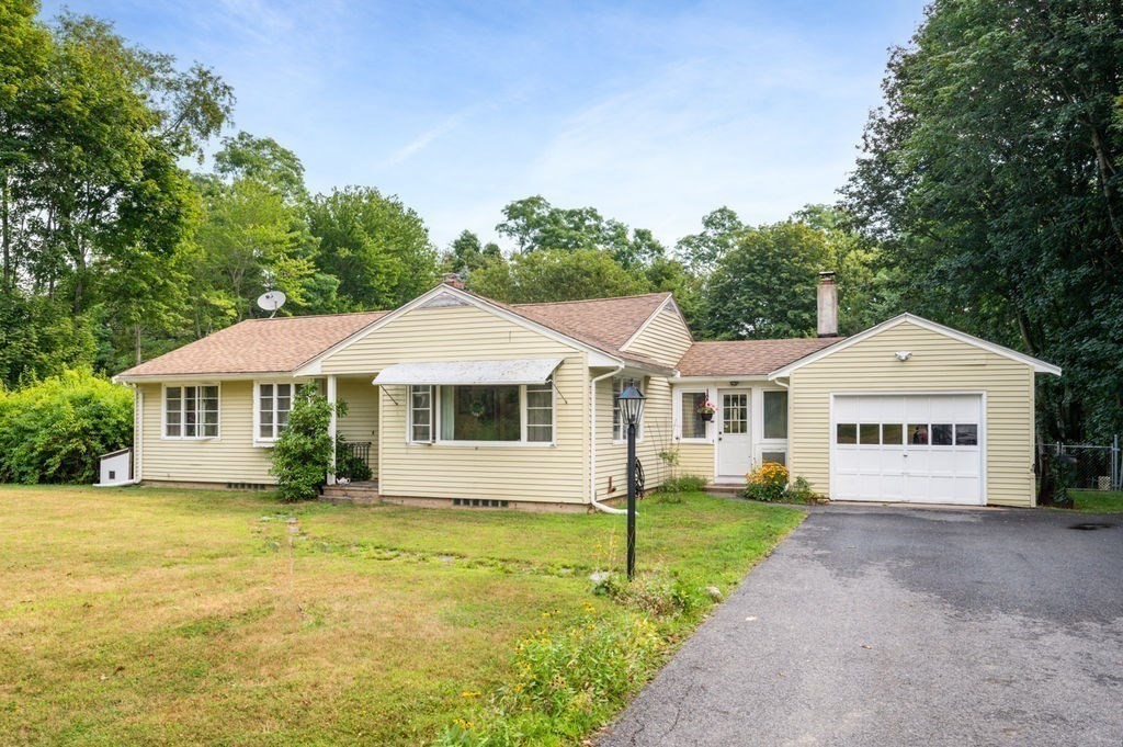 12 Kimball Road Amesbury, MA 01913 - Photo 2 of 36 a front view of a house with a garden