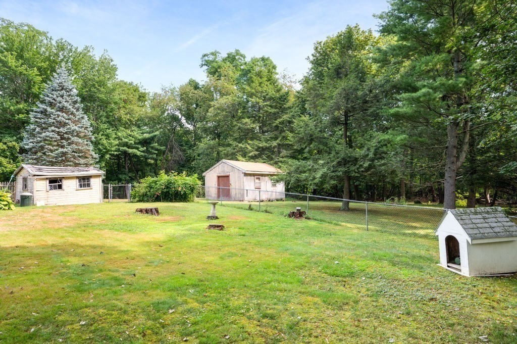 12 Kimball Road Amesbury, MA 01913 - Photo 29 of 36 a yellow and white house with a big yard