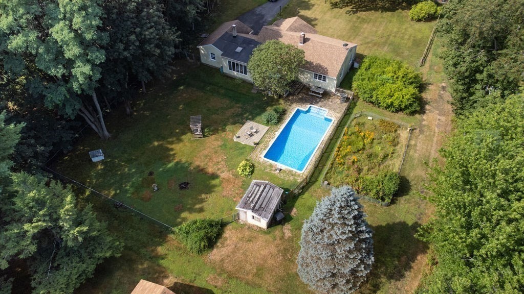 12 Kimball Road Amesbury, MA 01913 - Photo 32 of 36 an aerial view of a house with outdoor space swimming pool and lake view