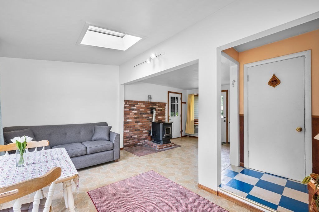 12 Kimball Road Amesbury, MA 01913 - Photo 7 of 36 a living room with furniture and a rug