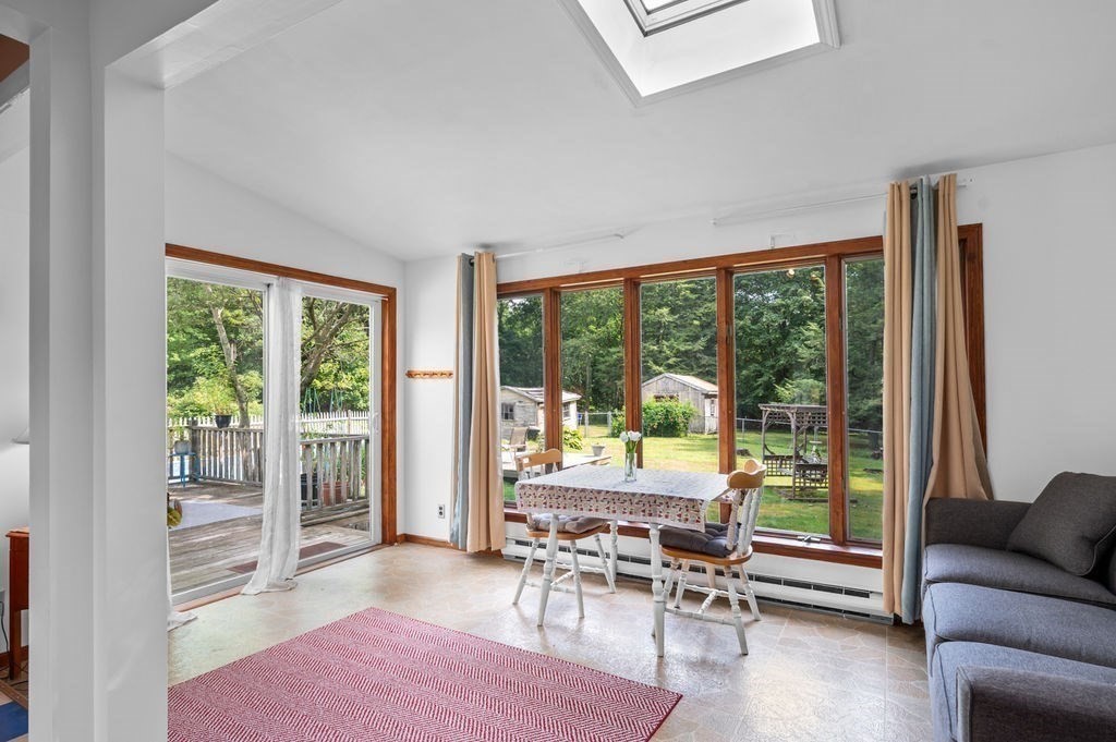12 Kimball Road Amesbury, MA 01913 - Photo 8 of 36 a living room with furniture and floor to ceiling windows