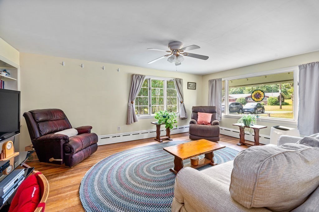 12 Kimball Road Amesbury, MA 01913 - Photo 10 of 36 a living room with furniture a rug and a large window