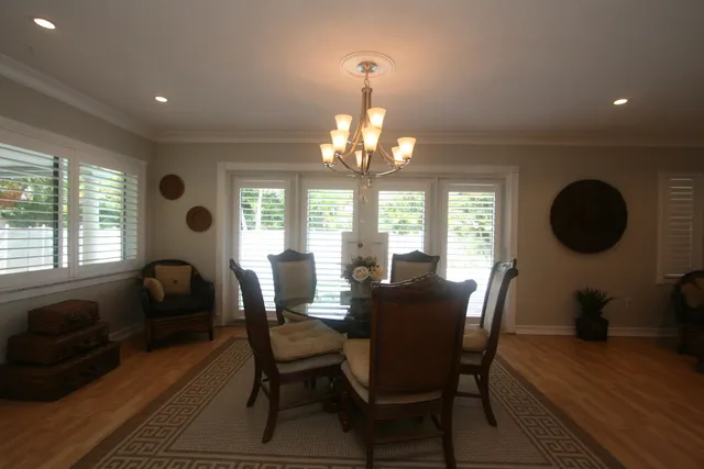 a dining room with furniture and window