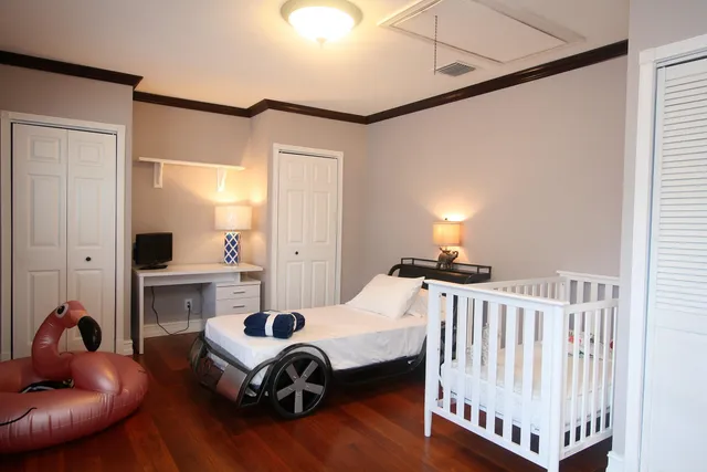 a bedroom with furniture and a window