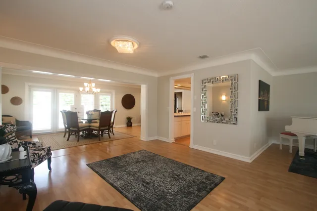 a living room with furniture and a table