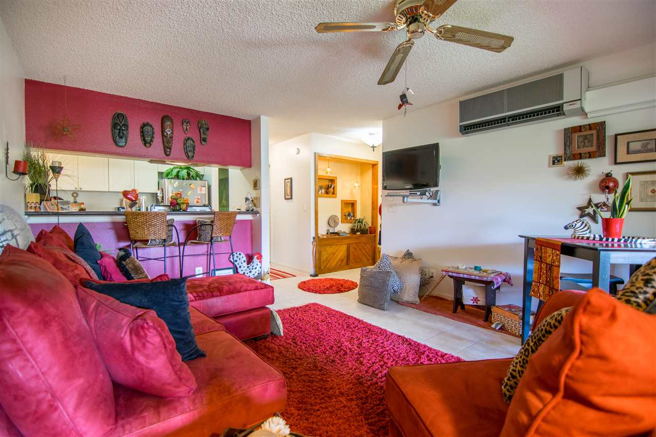 1450 South Kihei Road, Unit A205 Kihei, HI 96753 - Photo 1 of 24 a bedroom with furniture and a flat screen tv