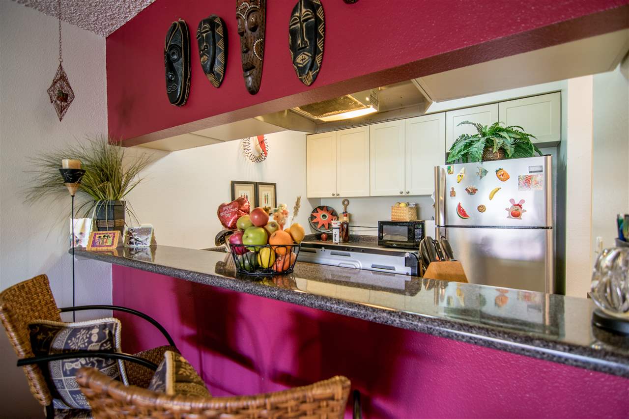 1450 South Kihei Road, Unit A205 Kihei, HI 96753 - Photo 12 of 24 a view of a room with workspace and mirror