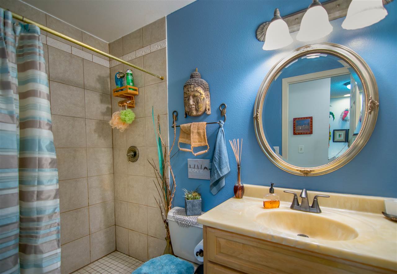 1450 South Kihei Road, Unit A205 Kihei, HI 96753 - Photo 20 of 24 a bathroom with a sink and mirror