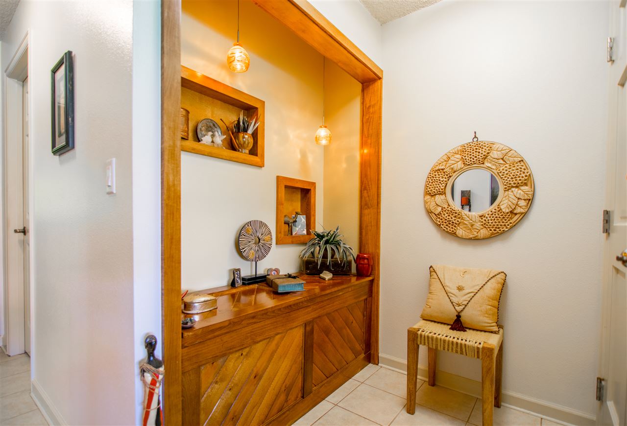 1450 South Kihei Road, Unit A205 Kihei, HI 96753 - Photo 4 of 24 a bathroom with a granite countertop sink and a mirror