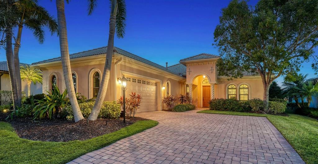 14717 Leopard Creek Place Lakewood Ranch, FL 34202 - Photo 1 of 1 a front view of a house with garden