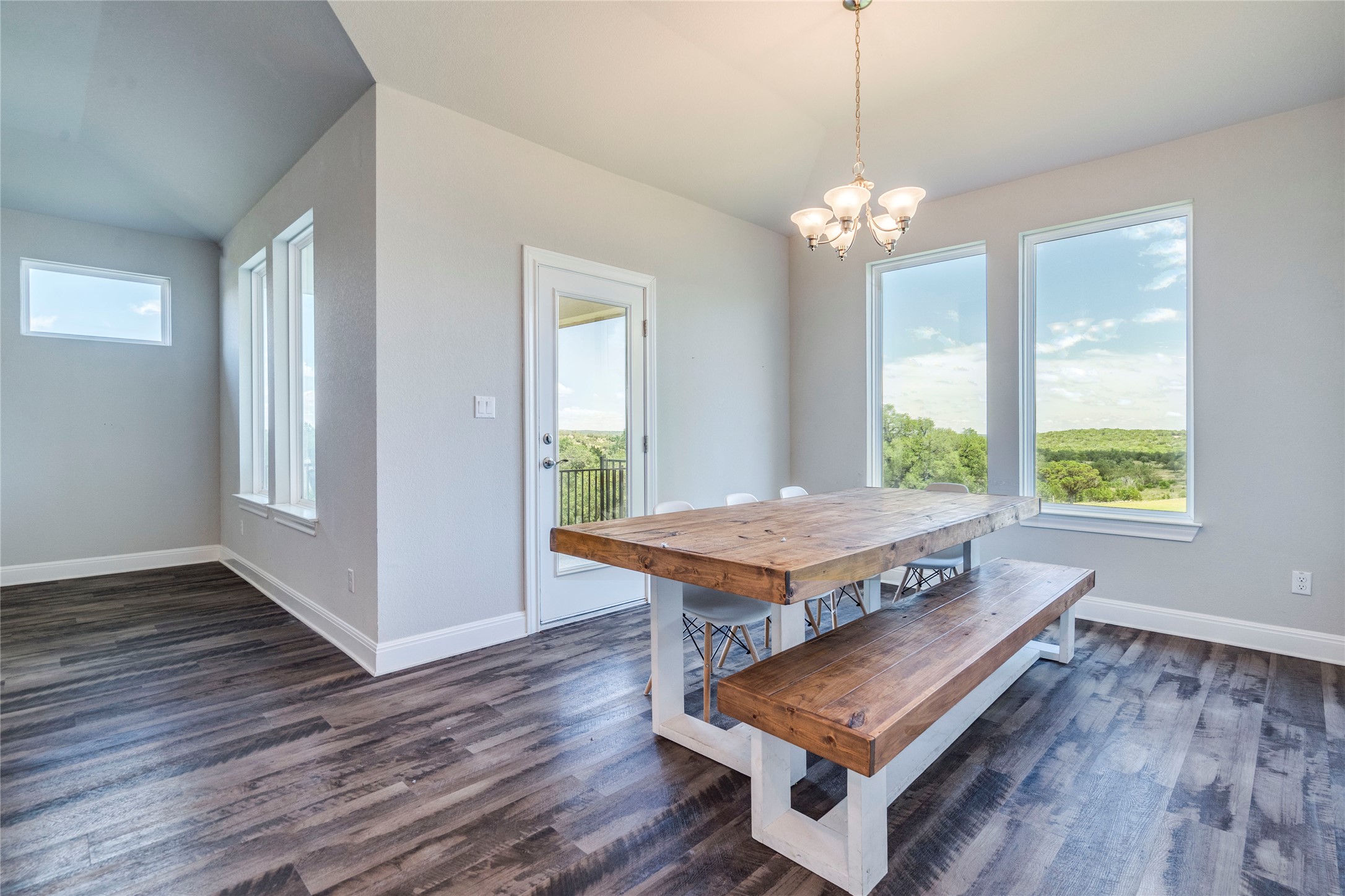 130 Sierra Blanca Road Dripping Springs, TX 78620 - Photo 12 of 24 a room with wooden floor pool table and windows