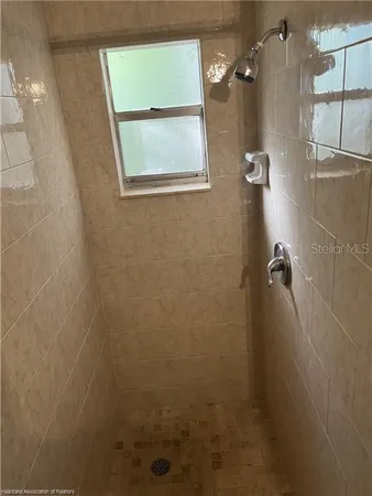 a potted plant sitting in front of a glass door