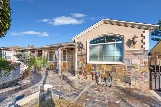 a front view of a house with patio