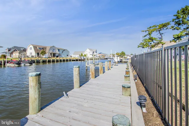 a large kitchen with granite countertop a sink and a stove