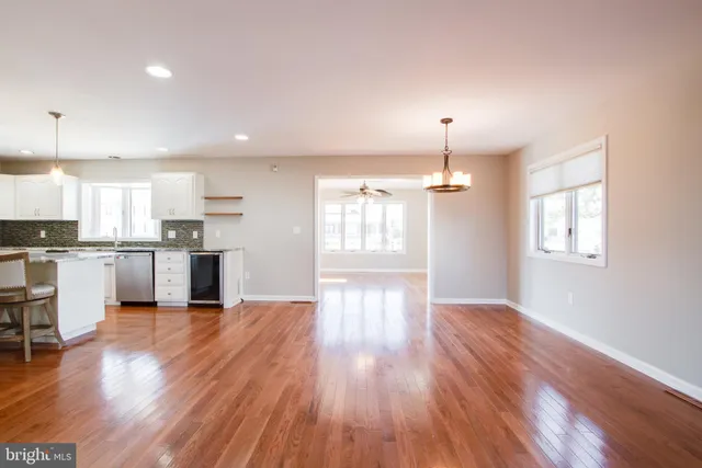 a bathroom with a double vanity sink mirror and bathtub