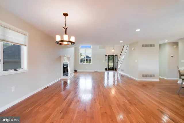 a view of a livingroom with a ceiling fan and window