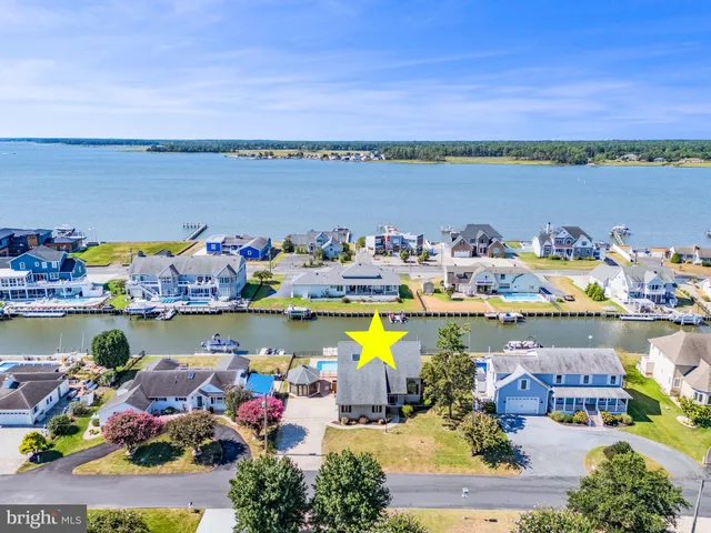 a view of a house with potted plants
