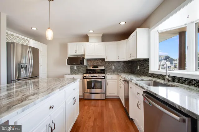a bathroom with a toilet sink and shower