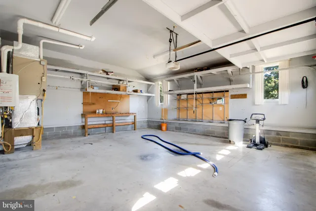 an aerial view of a house with a lake view
