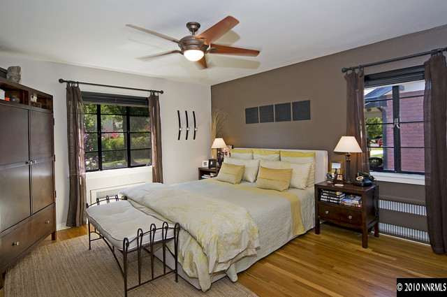 555 Reno Avenue Reno, NV 89509 - Photo 7 of 9 a bedroom with a bed and wooden floor