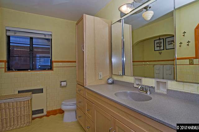 555 Reno Avenue Reno, NV 89509 - Photo 8 of 9 a bathroom with a granite countertop sink toilet and shower