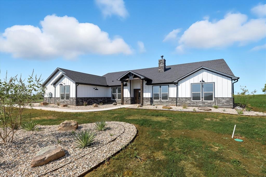835 Clb Lk Road Whitesboro, TX 76273 - Photo 2 of 33 a front view of a house with garden