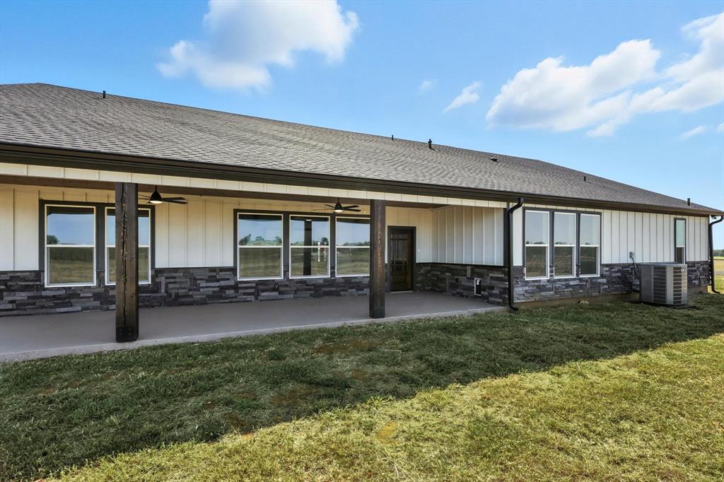 835 Clb Lk Road Whitesboro, TX 76273 - Photo 30 of 33 a house view with a garden space