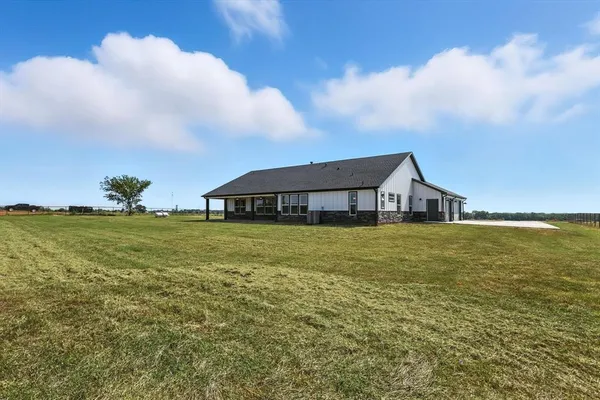 a front view of house with garden