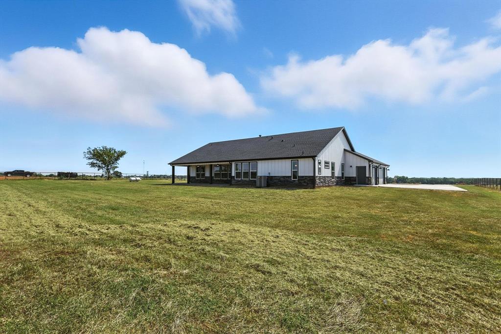 835 Clb Lk Road Whitesboro, TX 76273 - Photo 31 of 33 a front view of house with garden