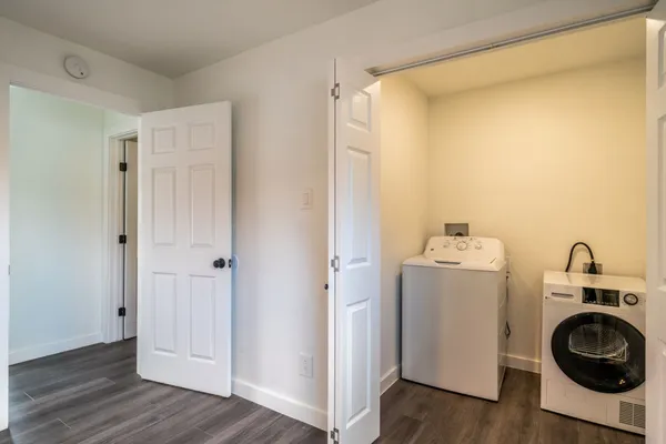 a view of a storage & utility room with wooden floor