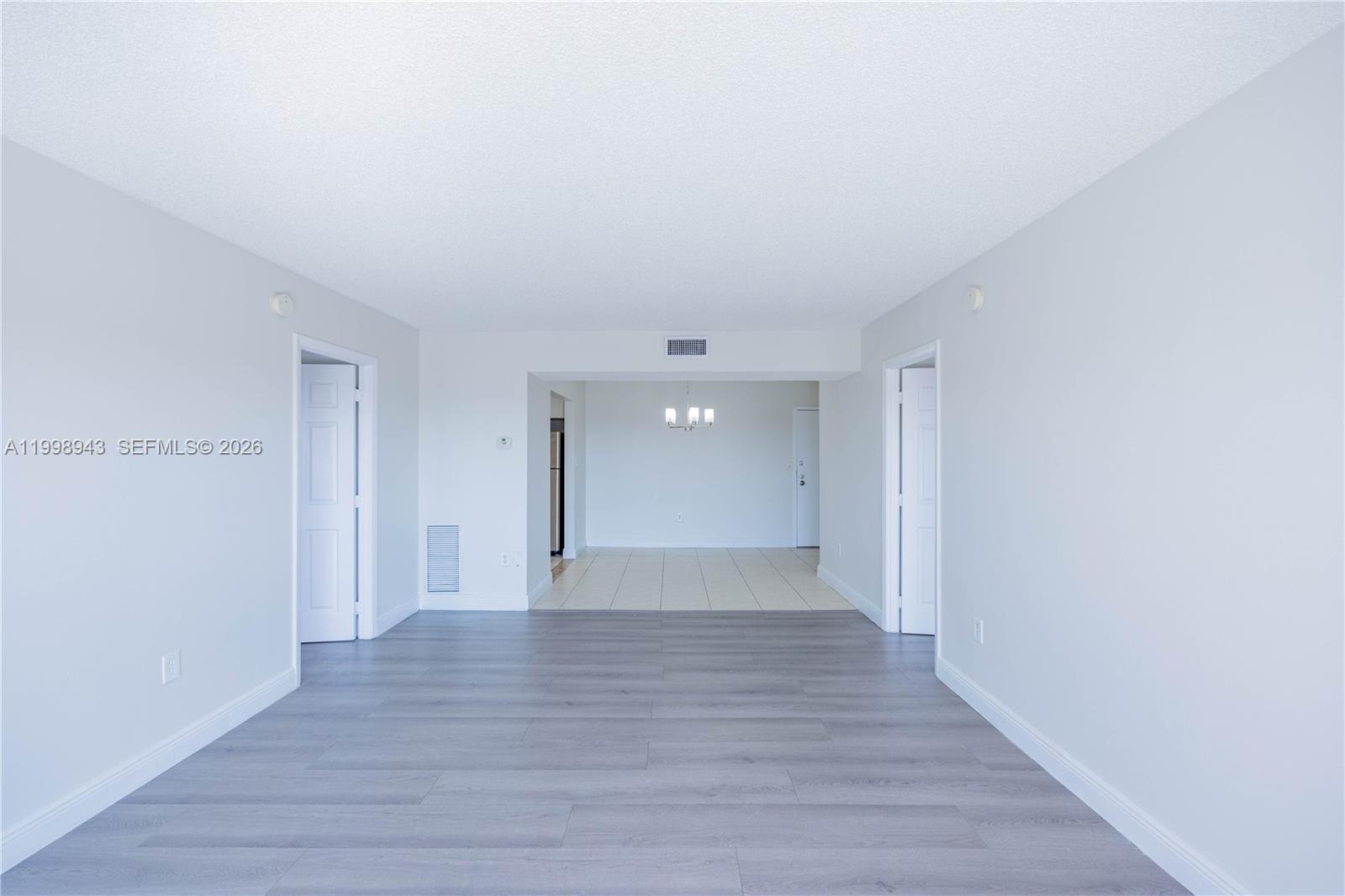 4164 Inverrary Drive, Unit 812 Lauderhill, FL 33319 - Photo 13 of 21 a view of an empty room with wooden floor